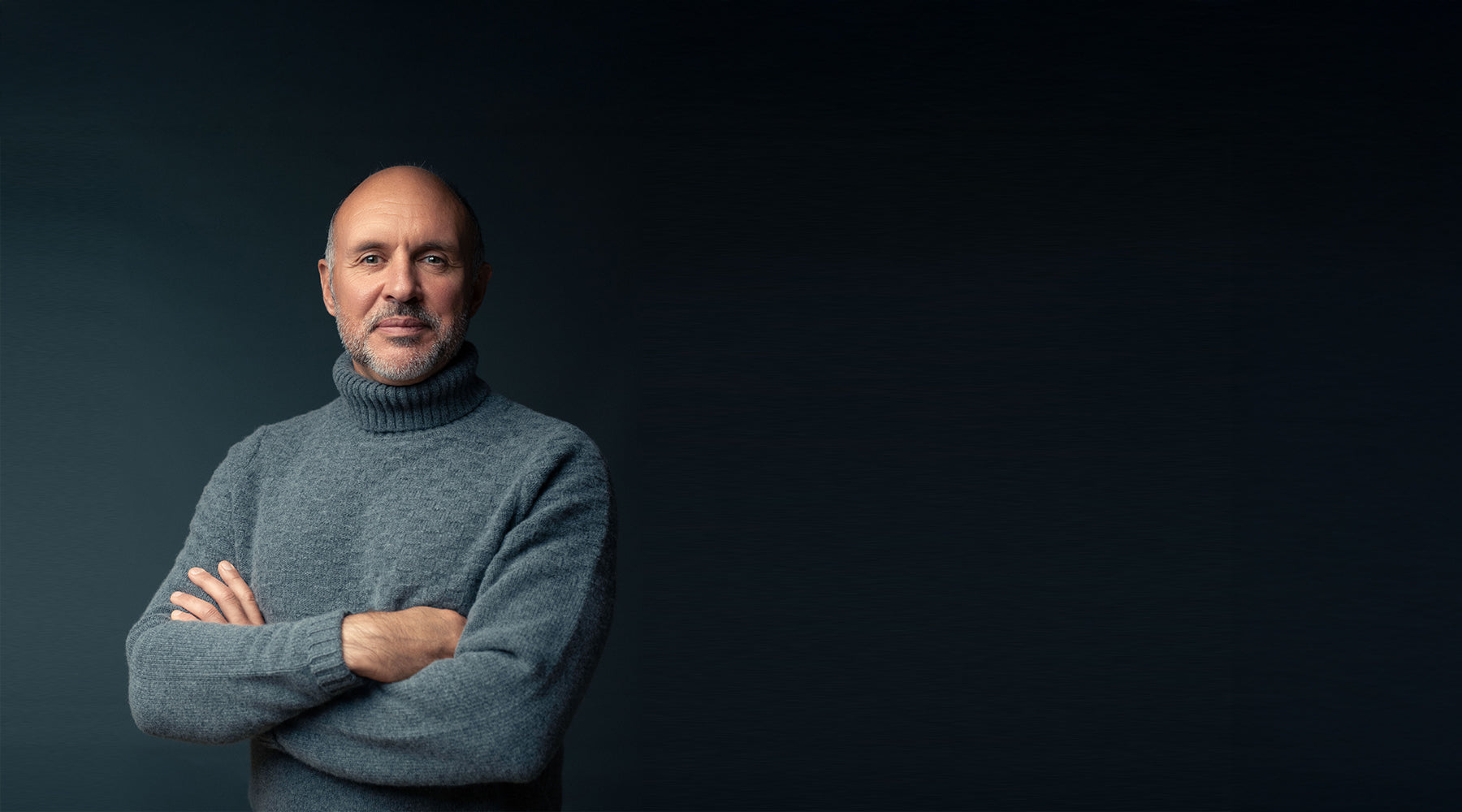 Louis Rudd stands with his arms crossed weather the Hero Sweater from Shacketon, photographer by Martin Hartley